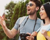 Smiling man and woman looking away